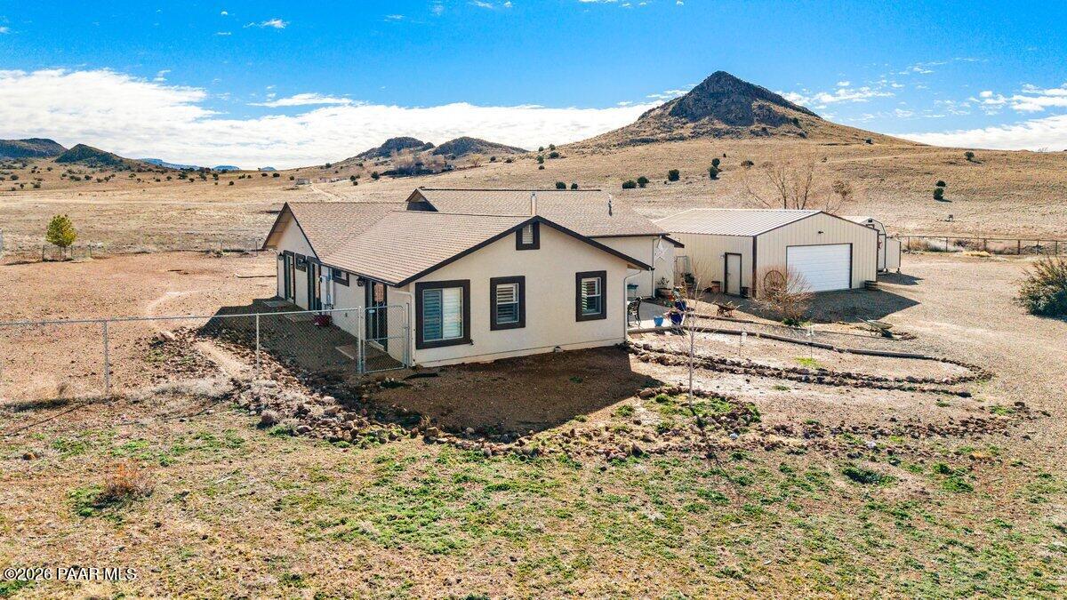 5757 East Longhorn Road Chino Valley, AZ 86323 - Photo 6 of 34 a view of a large house with a mountain