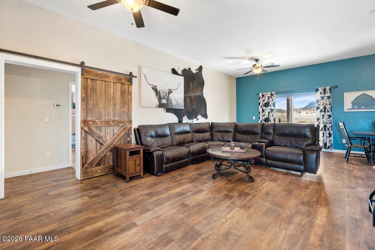 5757 East Longhorn Road Chino Valley, AZ 86323 - Photo 8 of 34 a living room with furniture and a wooden floor