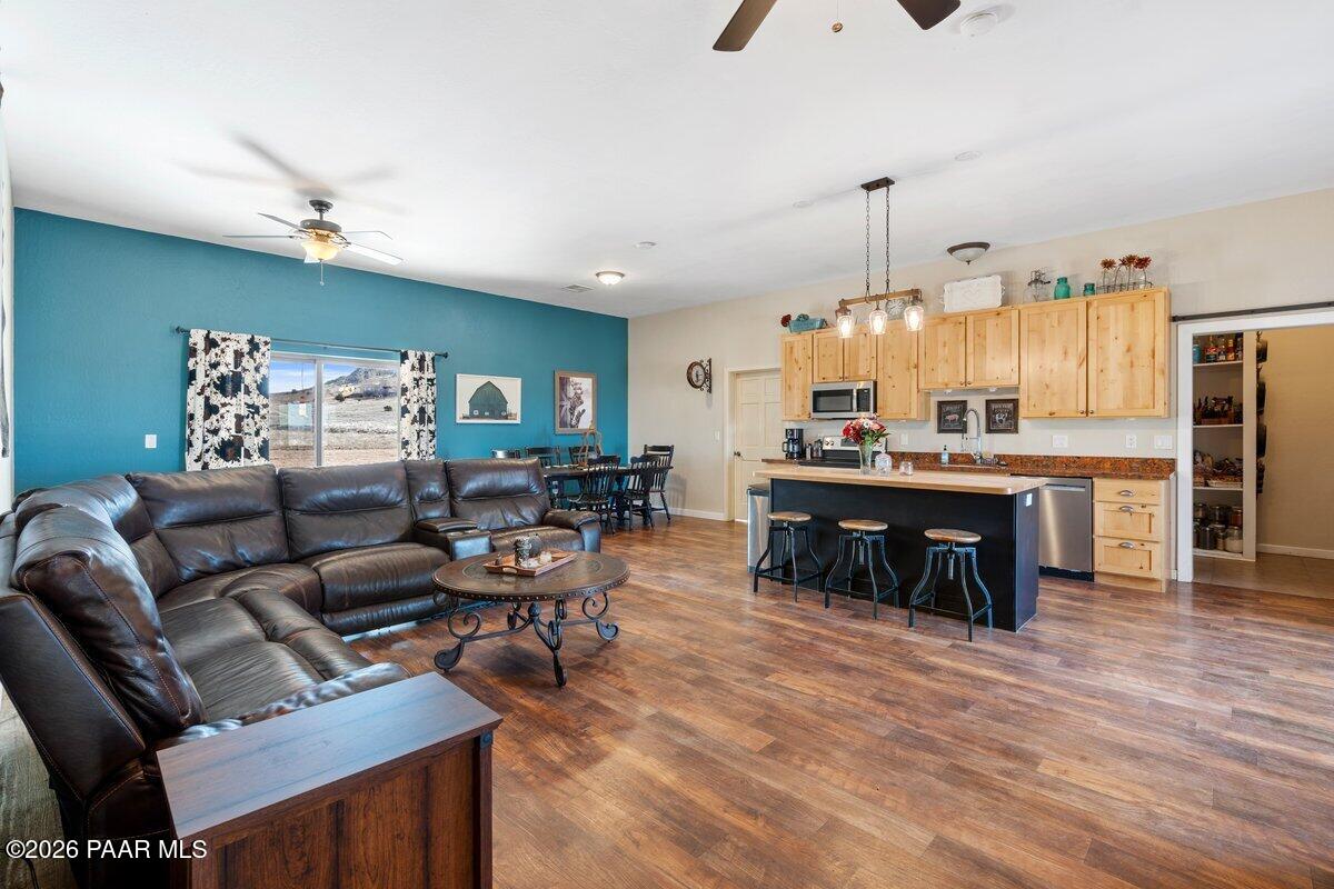 5757 East Longhorn Road Chino Valley, AZ 86323 - Photo 9 of 34 a living room with furniture and kitchen view