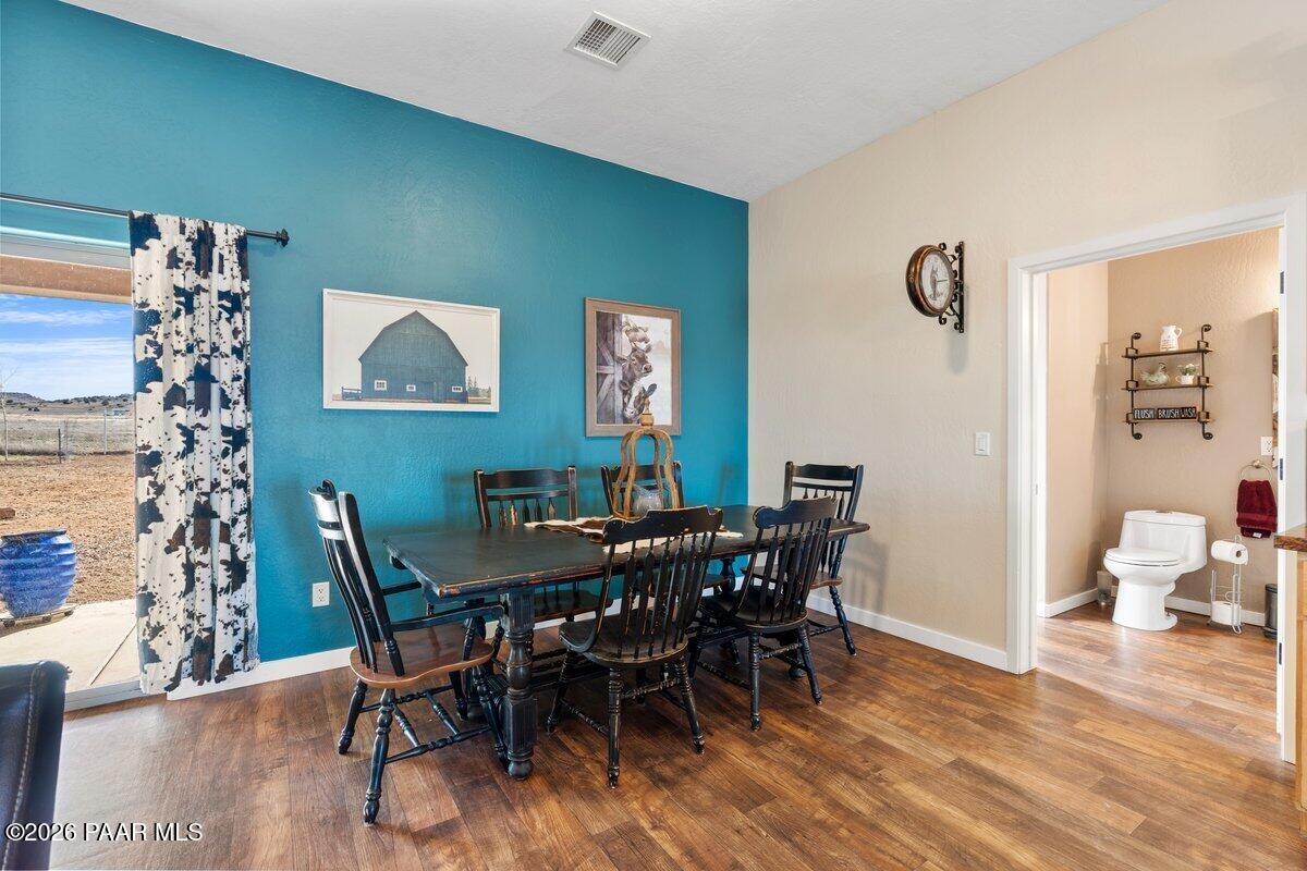 5757 East Longhorn Road Chino Valley, AZ 86323 - Photo 10 of 34 a view of a dining room with furniture and wooden floor