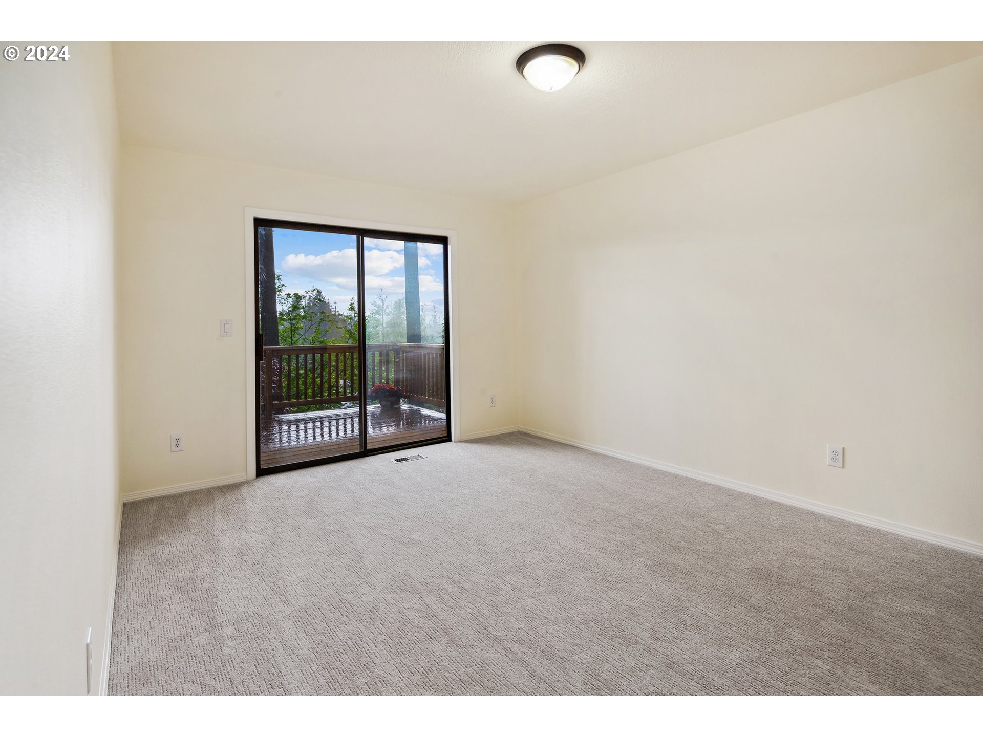 4243 Southwest Stephenson Street Portland, OR 97219 - Photo 25 of 48 a view of an empty room with wooden floor