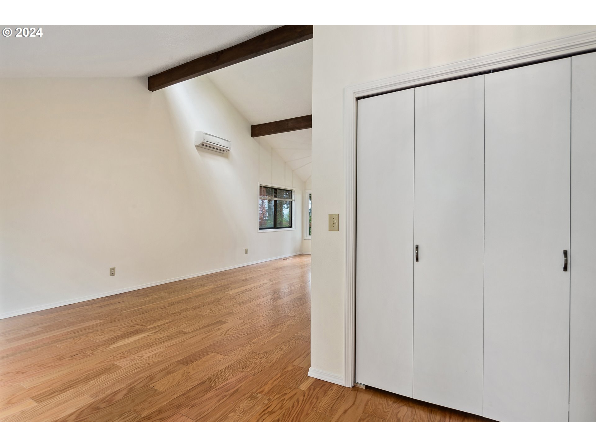 4243 Southwest Stephenson Street Portland, OR 97219 - Photo 4 of 48 a view of an empty room with wooden floor