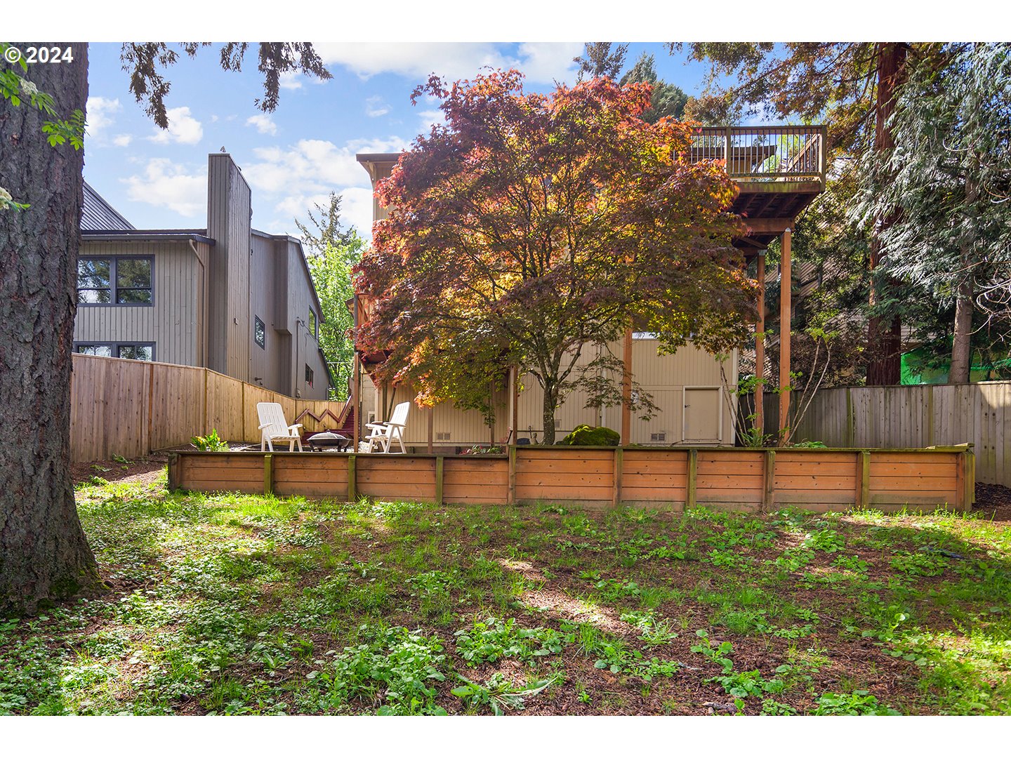 4243 Southwest Stephenson Street Portland, OR 97219 - Photo 47 of 48 a view of a house with a yard