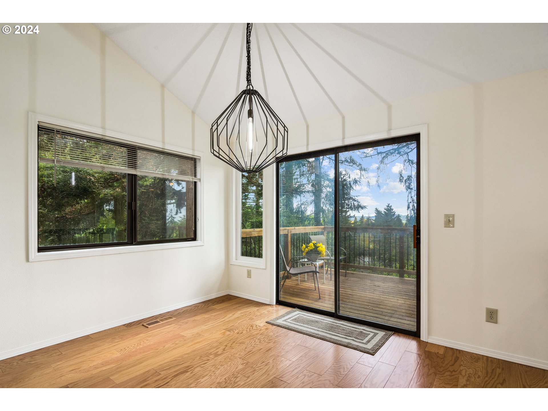 4243 Southwest Stephenson Street Portland, OR 97219 - Photo 9 of 48 a view of empty room with floor to ceiling window