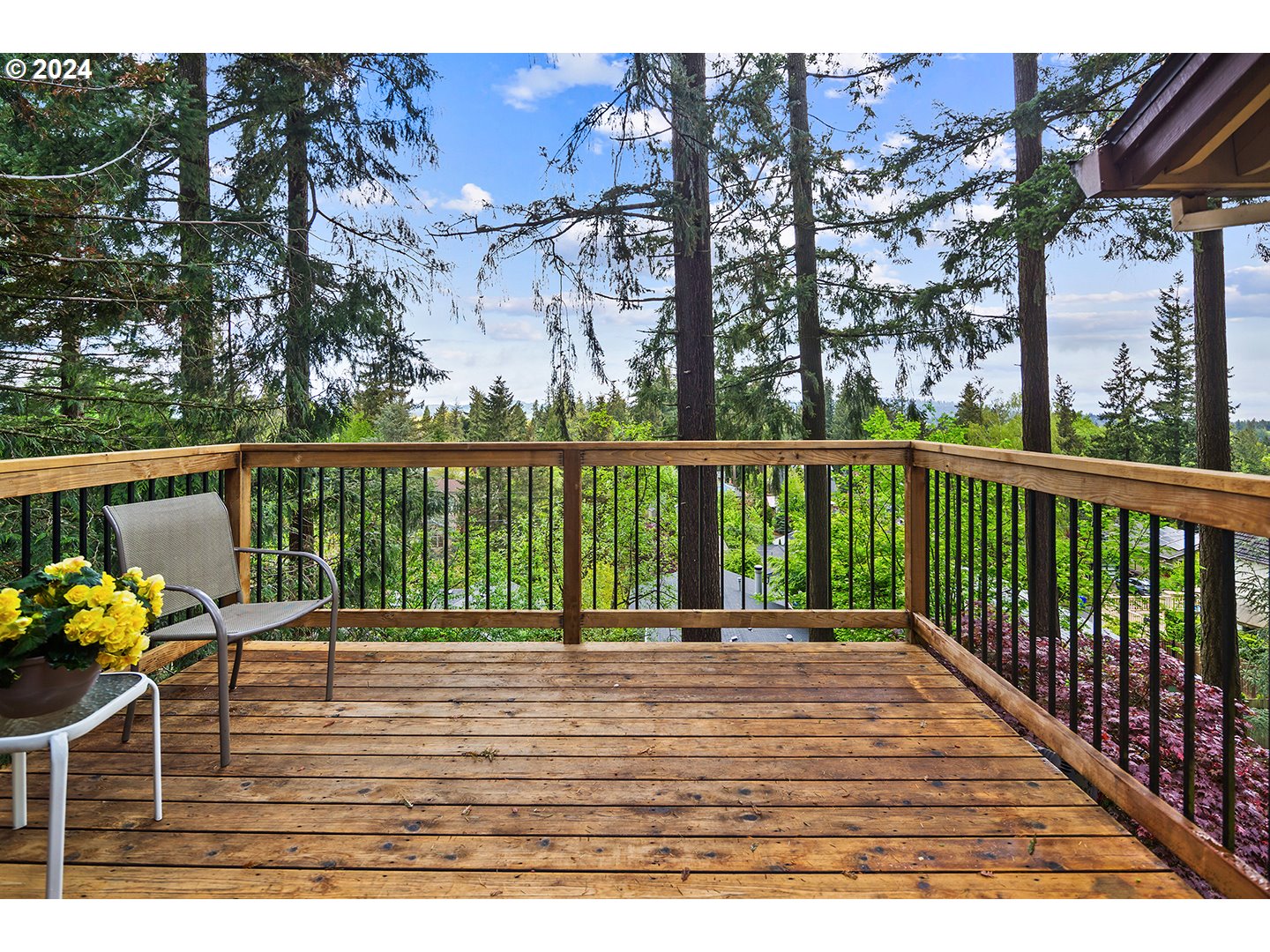 4243 Southwest Stephenson Street Portland, OR 97219 - Photo 10 of 48 a view of a balcony with chairs