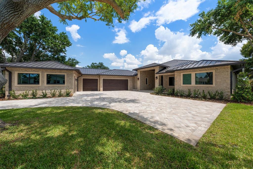 19 Hibiscus Road Belleair, FL 33756 - Photo 1 of 44 a front view of house with yard and green space