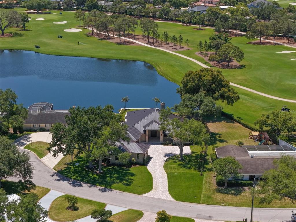 19 Hibiscus Road Belleair, FL 33756 - Photo 13 of 44 an aerial view of a house with a garden and lake view