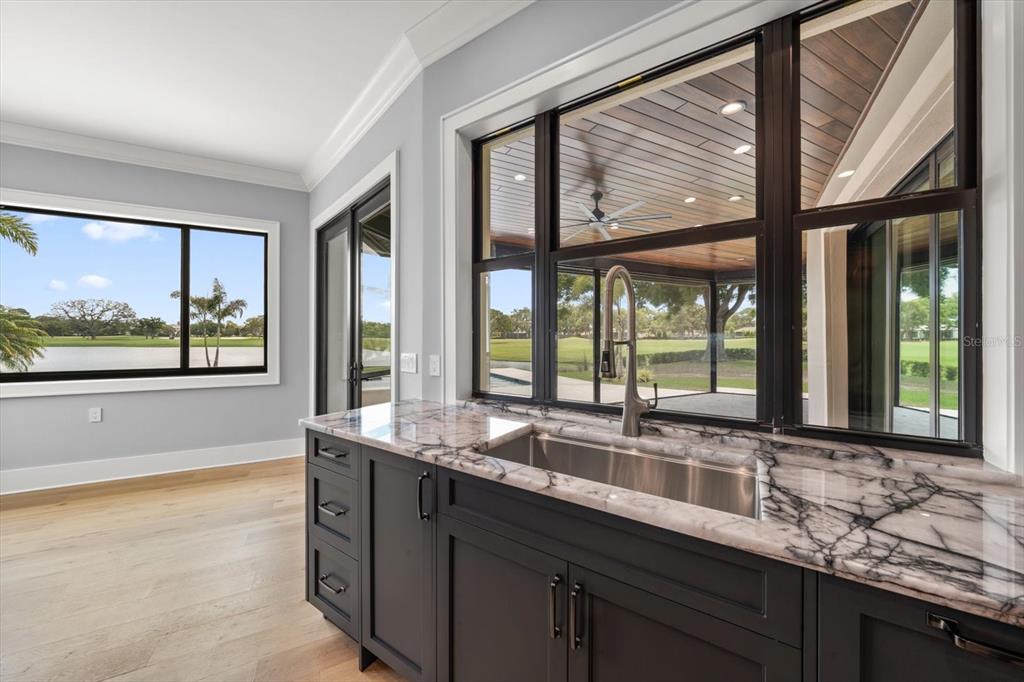 19 Hibiscus Road Belleair, FL 33756 - Photo 20 of 44 a kitchen with granite countertop a large window