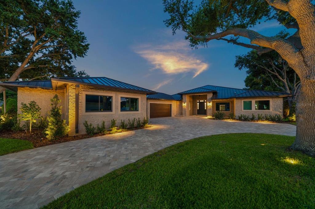 19 Hibiscus Road Belleair, FL 33756 - Photo 2 of 44 a front view of a house with a garden