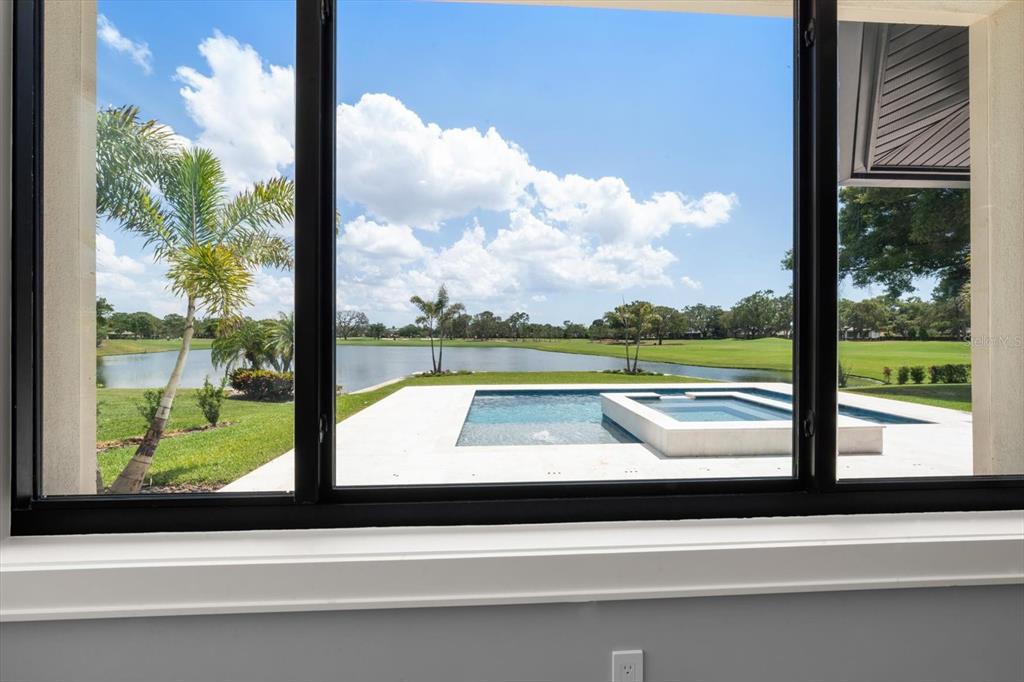 19 Hibiscus Road Belleair, FL 33756 - Photo 23 of 44 a view of swimming pool from a window