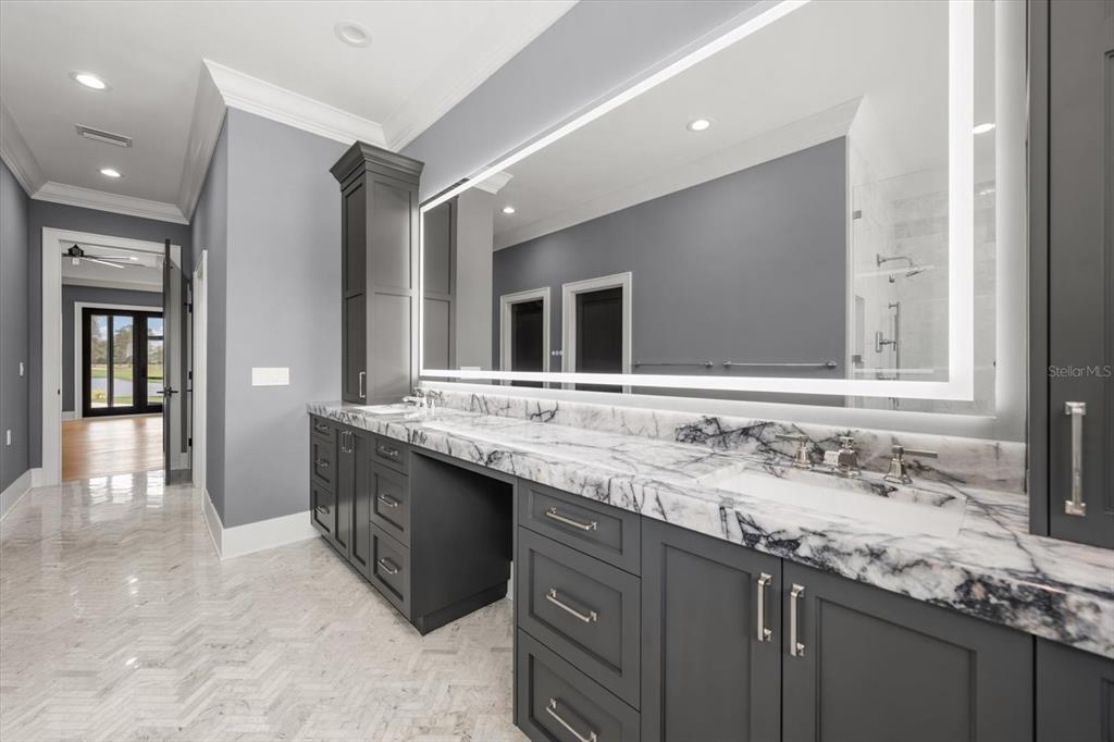 19 Hibiscus Road Belleair, FL 33756 - Photo 25 of 44 a bathroom with a sink double vanity and a mirror