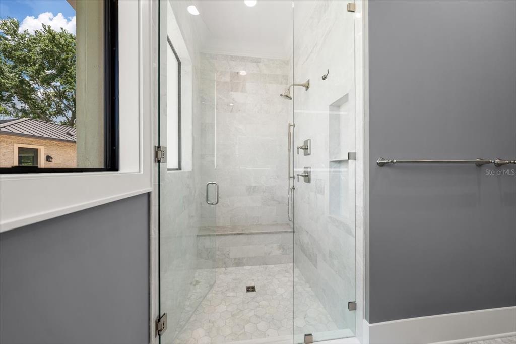 19 Hibiscus Road Belleair, FL 33756 - Photo 27 of 44 a bathroom with a shower and a sink