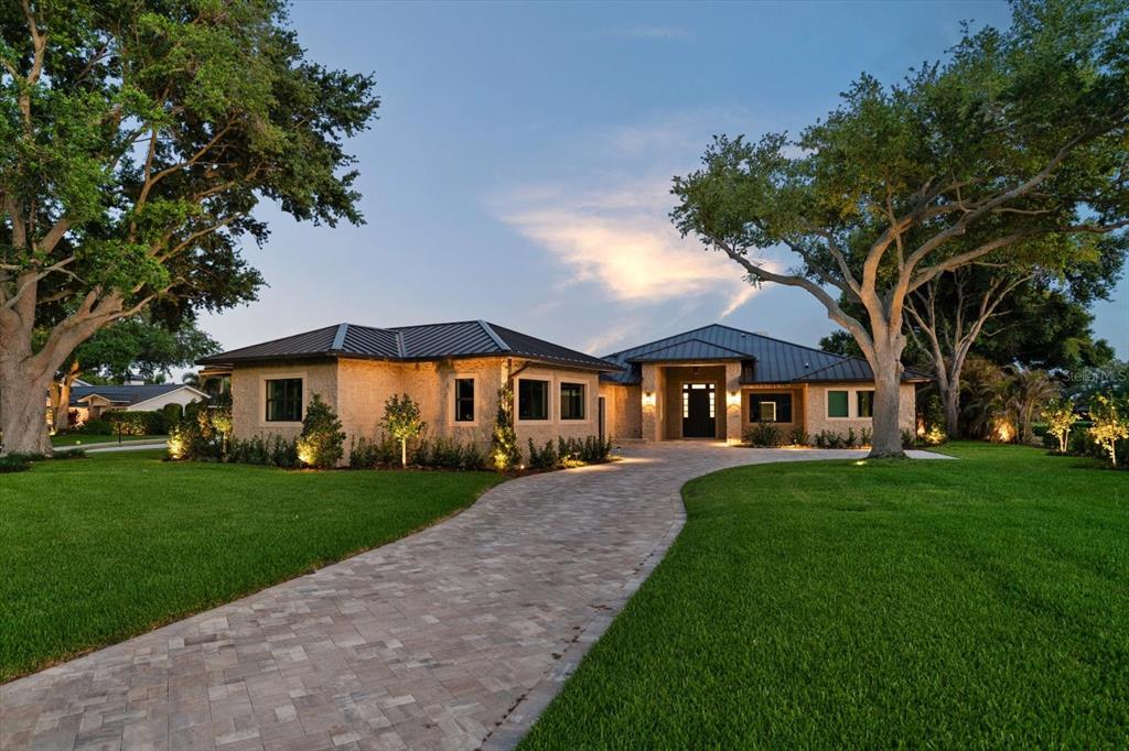 19 Hibiscus Road Belleair, FL 33756 - Photo 3 of 44 a front view of a house with a yard