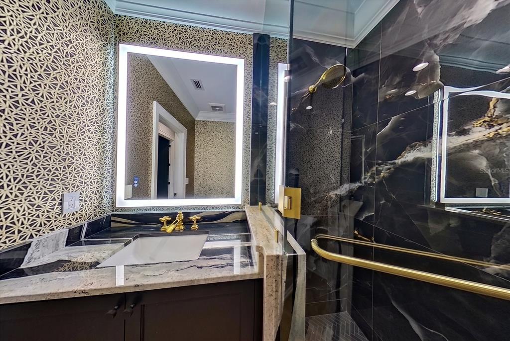 19 Hibiscus Road Belleair, FL 33756 - Photo 32 of 44 a bathroom with a sink and a mirror