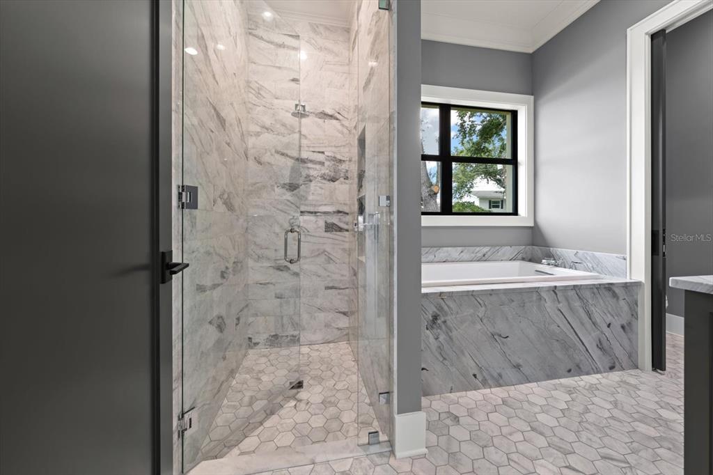 19 Hibiscus Road Belleair, FL 33756 - Photo 39 of 44 view of bathroom with tub shower and window
