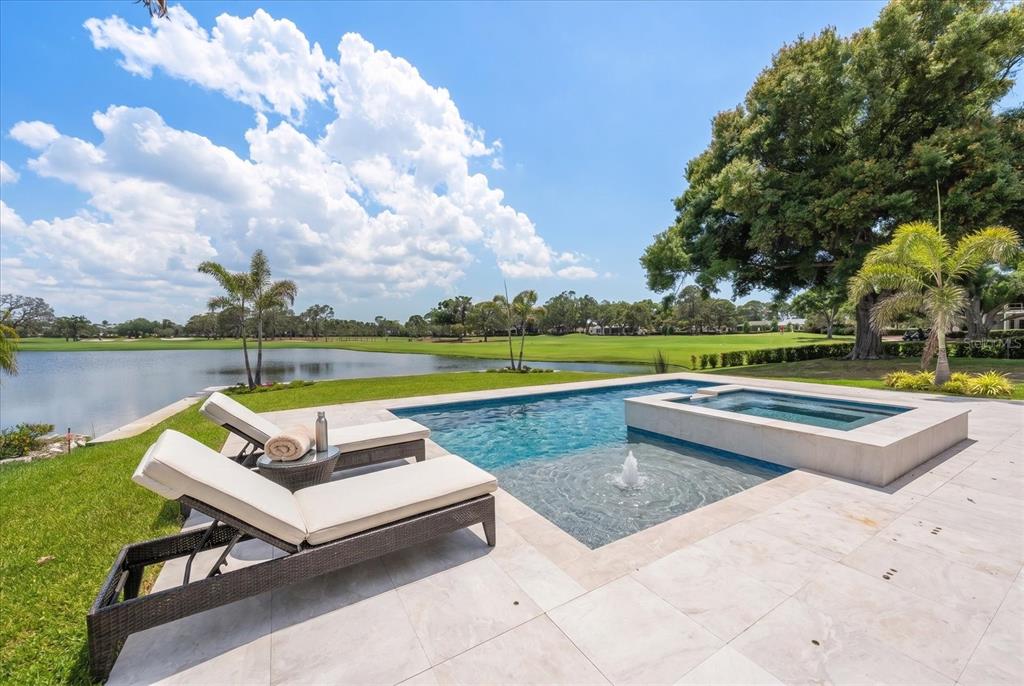 19 Hibiscus Road Belleair, FL 33756 - Photo 6 of 44 a view of swimming pool with lounge chair and yard in back