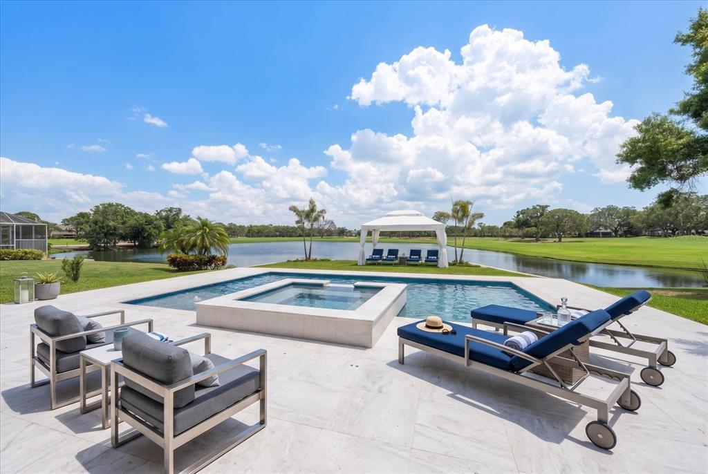 19 Hibiscus Road Belleair, FL 33756 - Photo 7 of 44 an outdoor space with swimming pool and furniture
