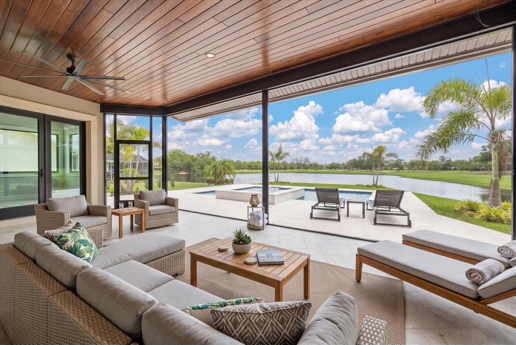 19 Hibiscus Road Belleair, FL 33756 - Photo 9 of 44 a living room with furniture and floor to ceiling windows