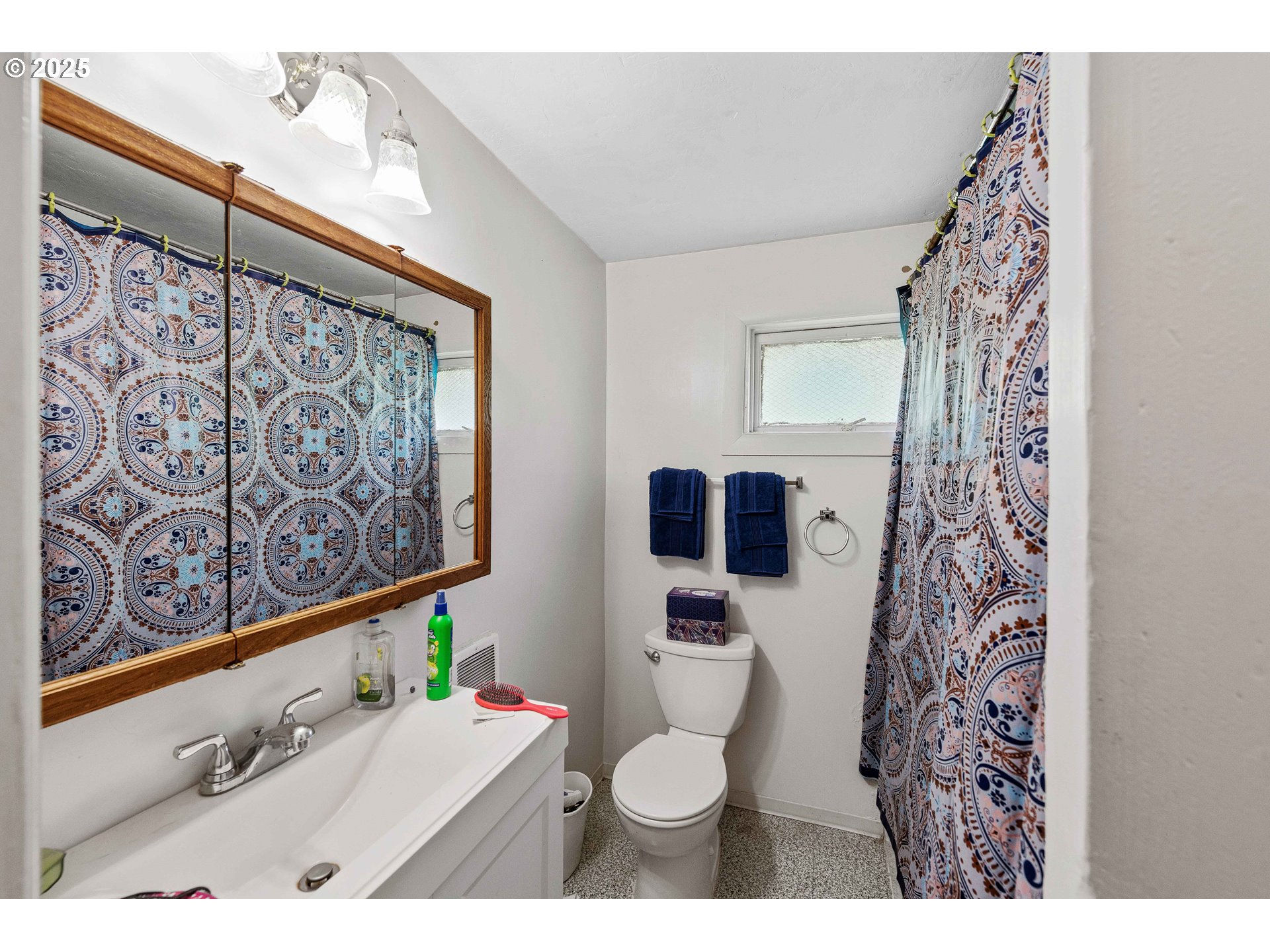 1902 Monroe Street North Bend, OR 97459 - Photo 13 of 48 a bathroom with a sink toilet and shower