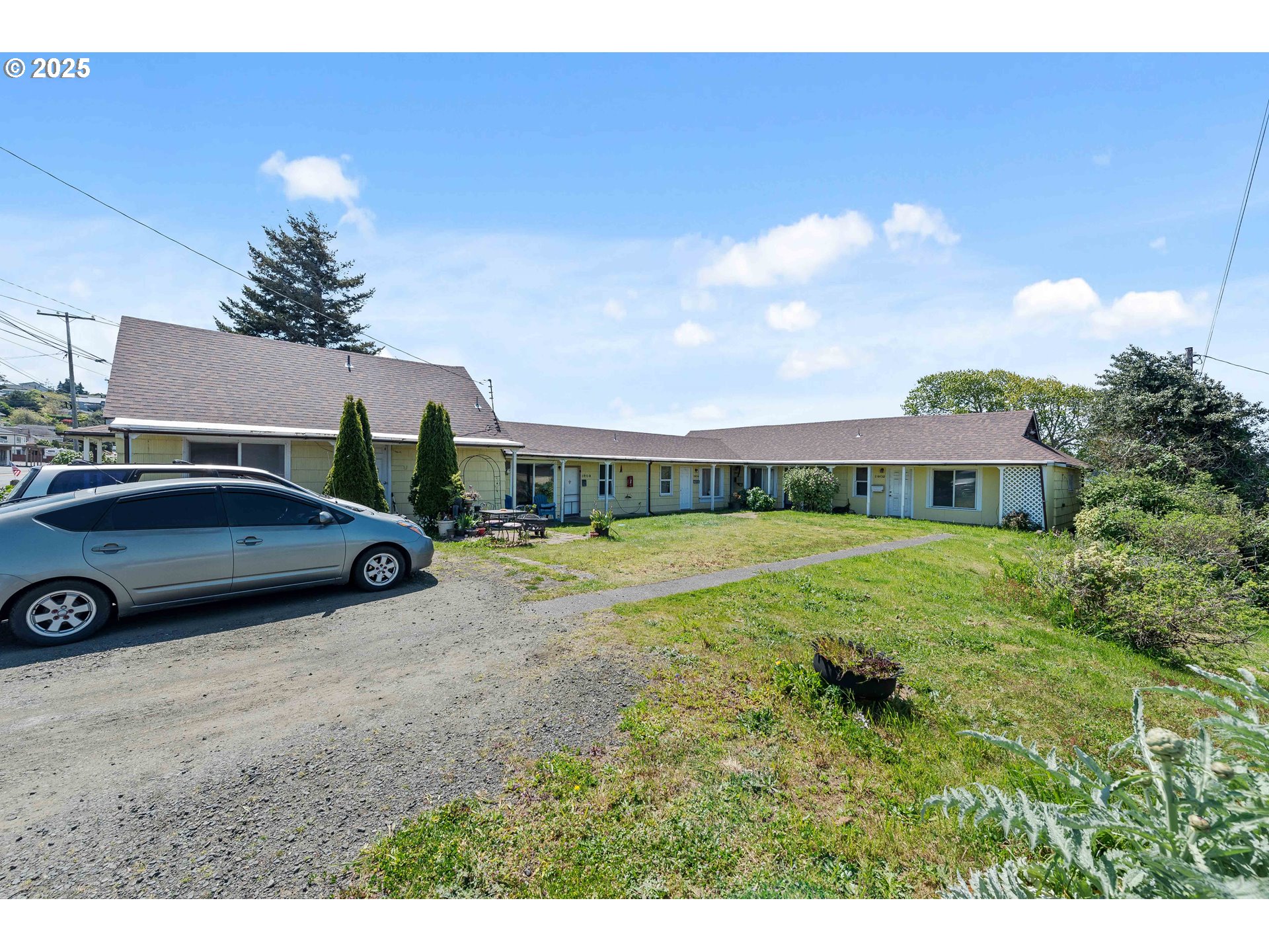 1902 Monroe Street North Bend, OR 97459 - Photo 2 of 48 a front view of a house with garden