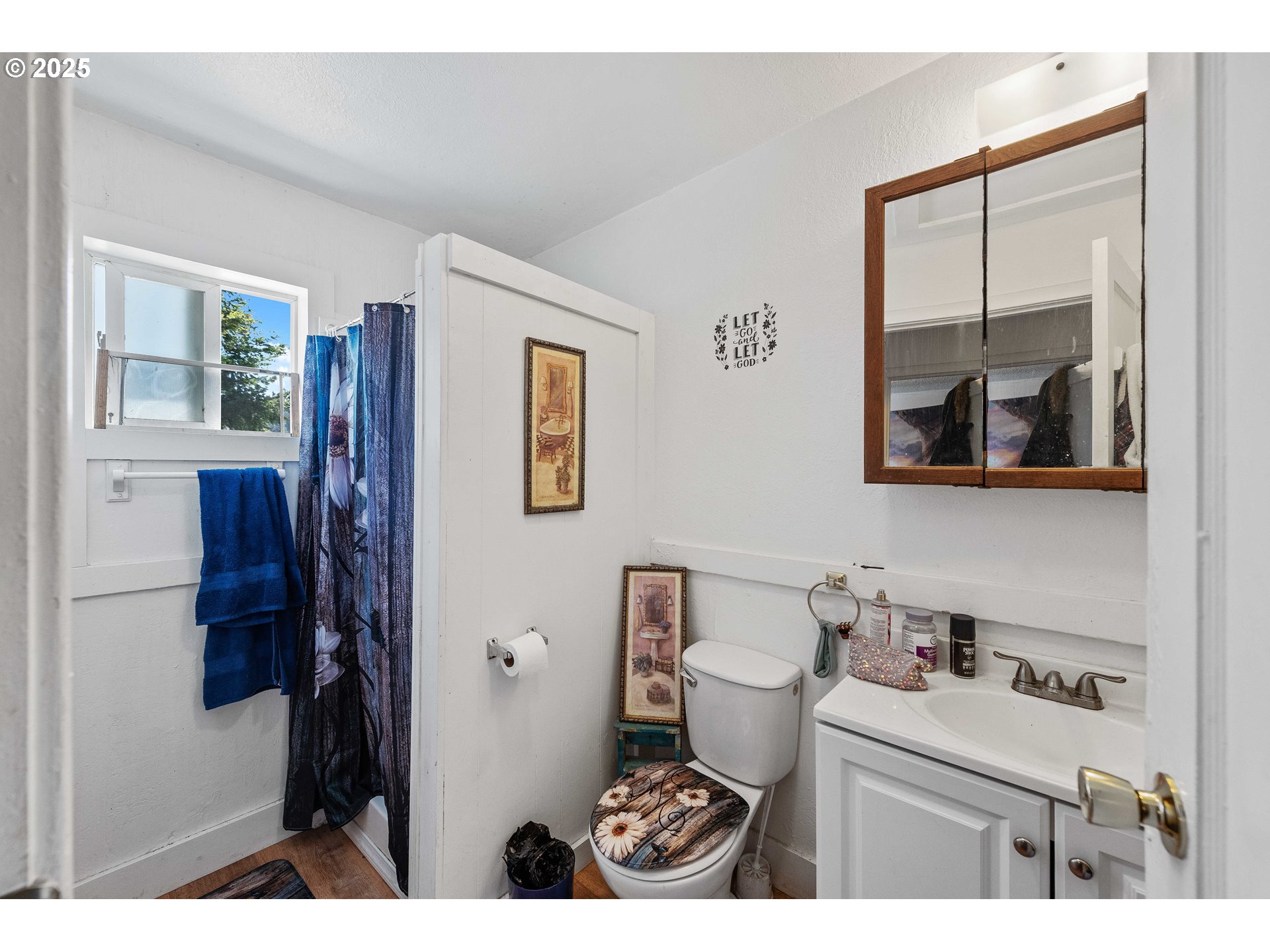 1902 Monroe Street North Bend, OR 97459 - Photo 26 of 48 a bathroom with a sink mirror vanity and toilet