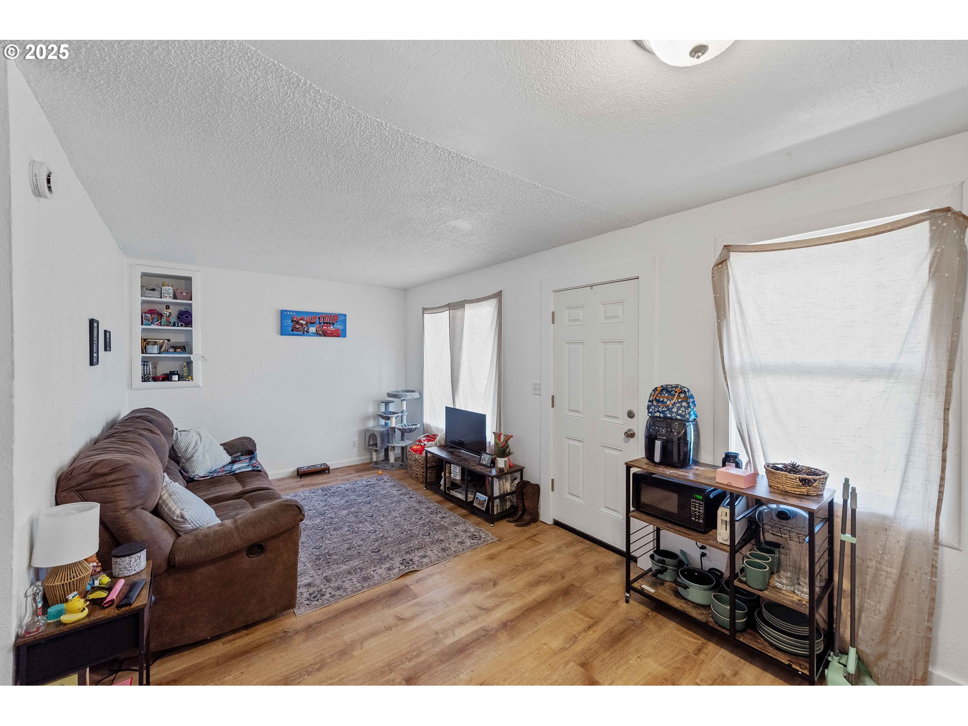 1902 Monroe Street North Bend, OR 97459 - Photo 28 of 48 a living room with furniture and a wooden floor