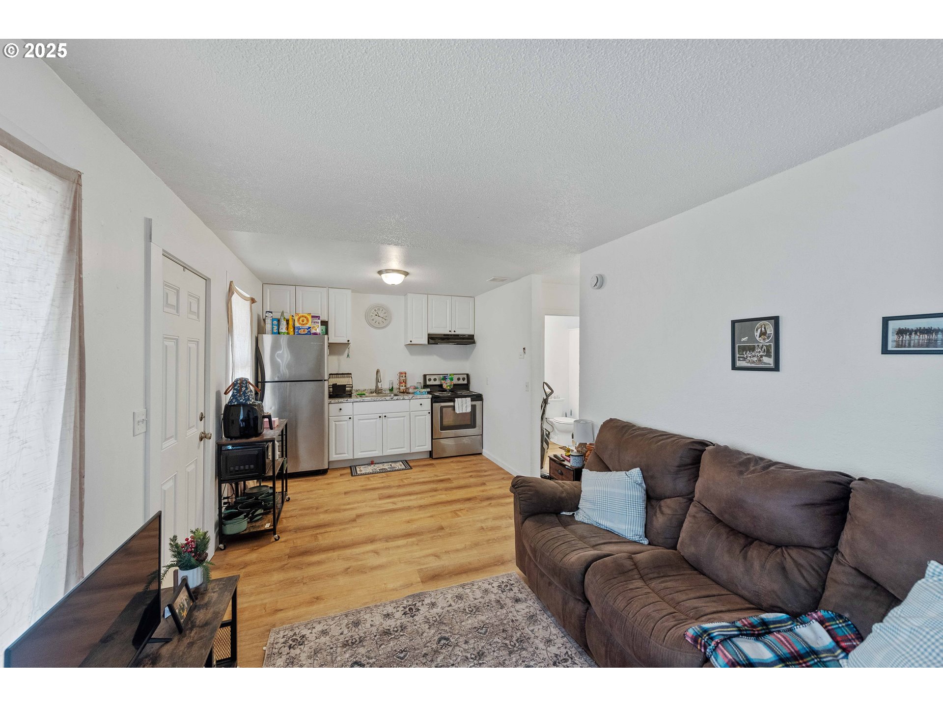 1902 Monroe Street North Bend, OR 97459 - Photo 29 of 48 a living room with furniture and a view of kitchen