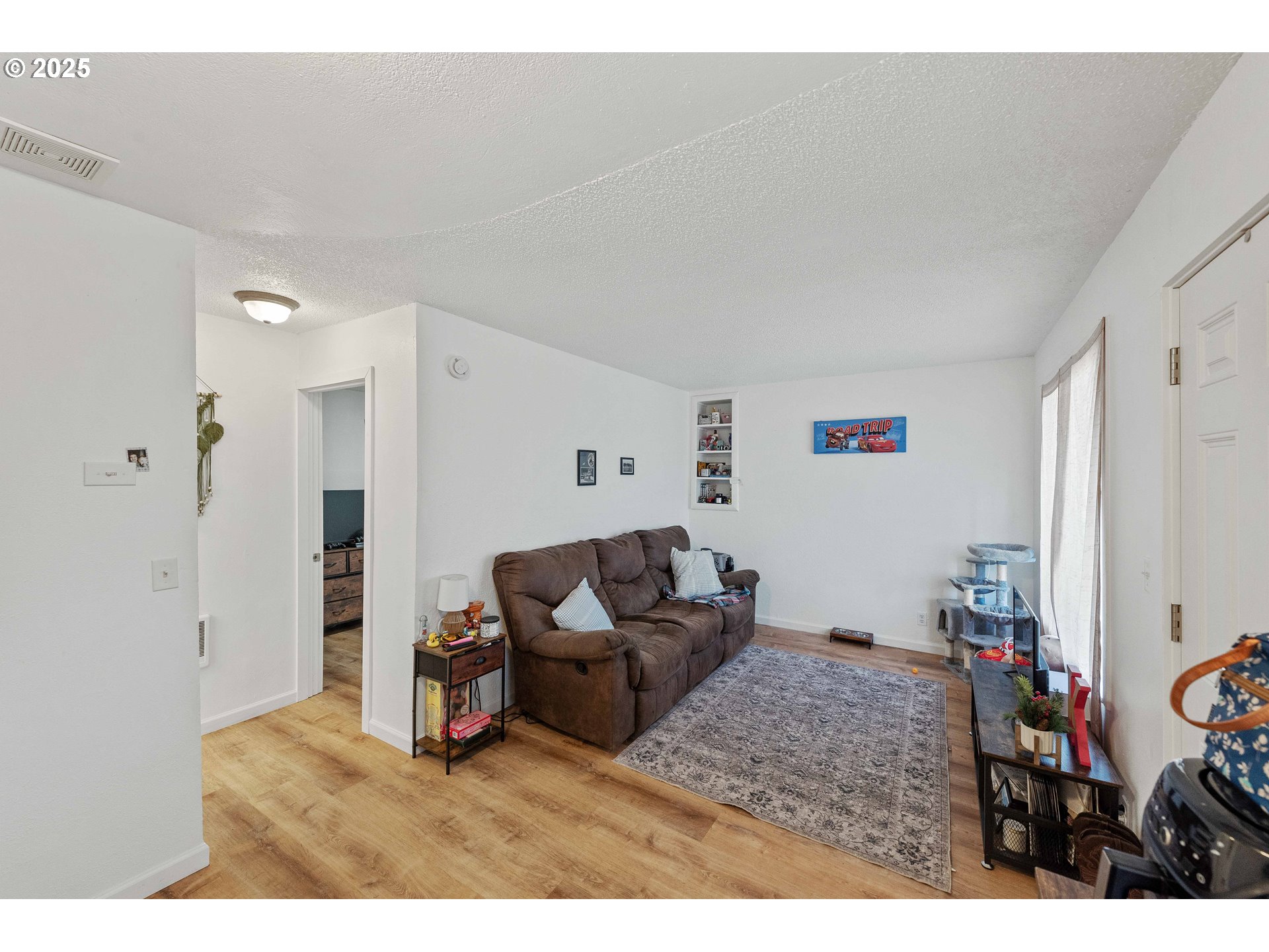 1902 Monroe Street North Bend, OR 97459 - Photo 30 of 48 a living room with furniture and a flat screen tv