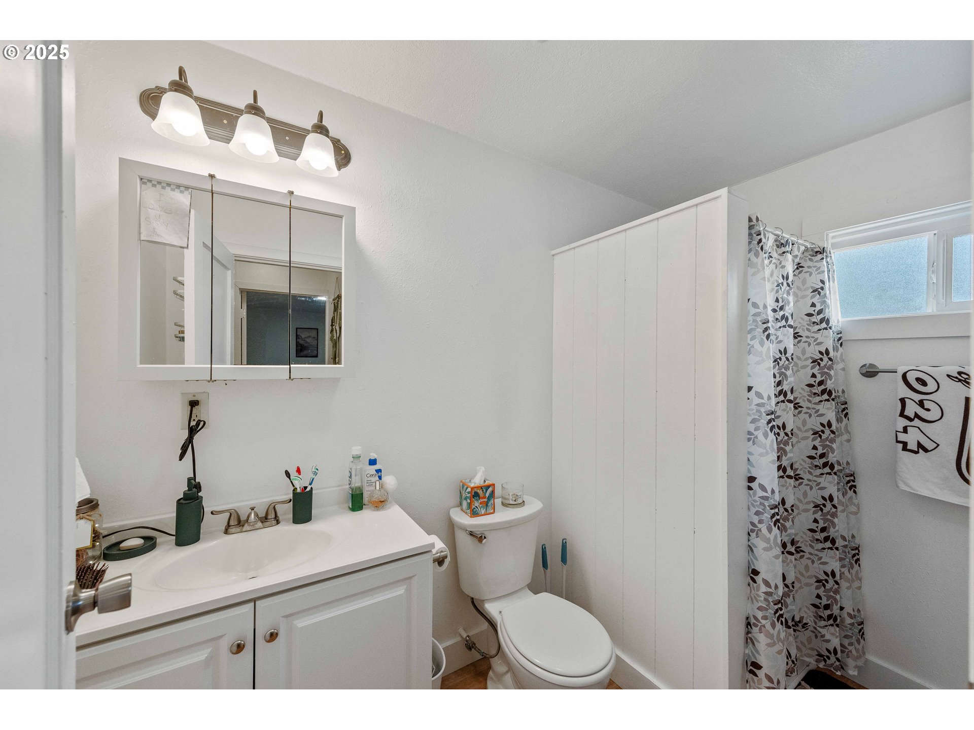 1902 Monroe Street North Bend, OR 97459 - Photo 31 of 48 a bathroom with a sink toilet and shower