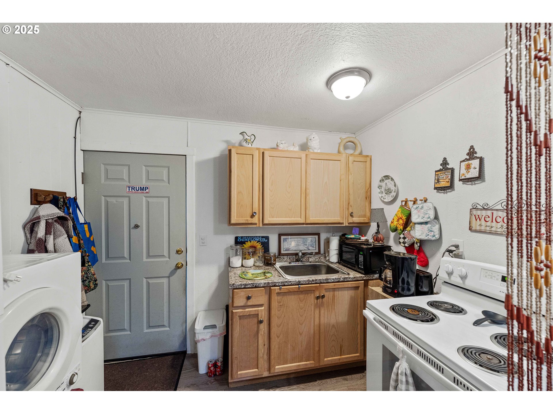 1902 Monroe Street North Bend, OR 97459 - Photo 35 of 48 a kitchen with stainless steel appliances granite countertop a stove and a refrigerator