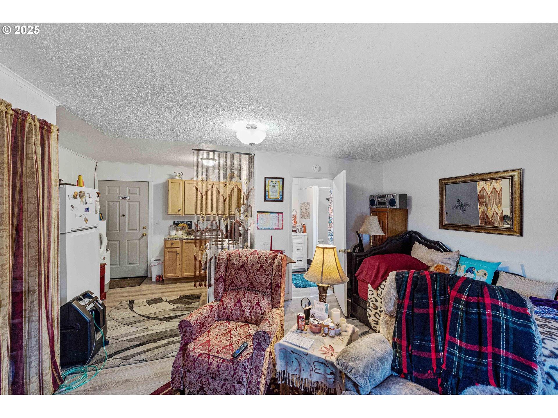 1902 Monroe Street North Bend, OR 97459 - Photo 36 of 48 a bedroom with furniture and a flat screen tv