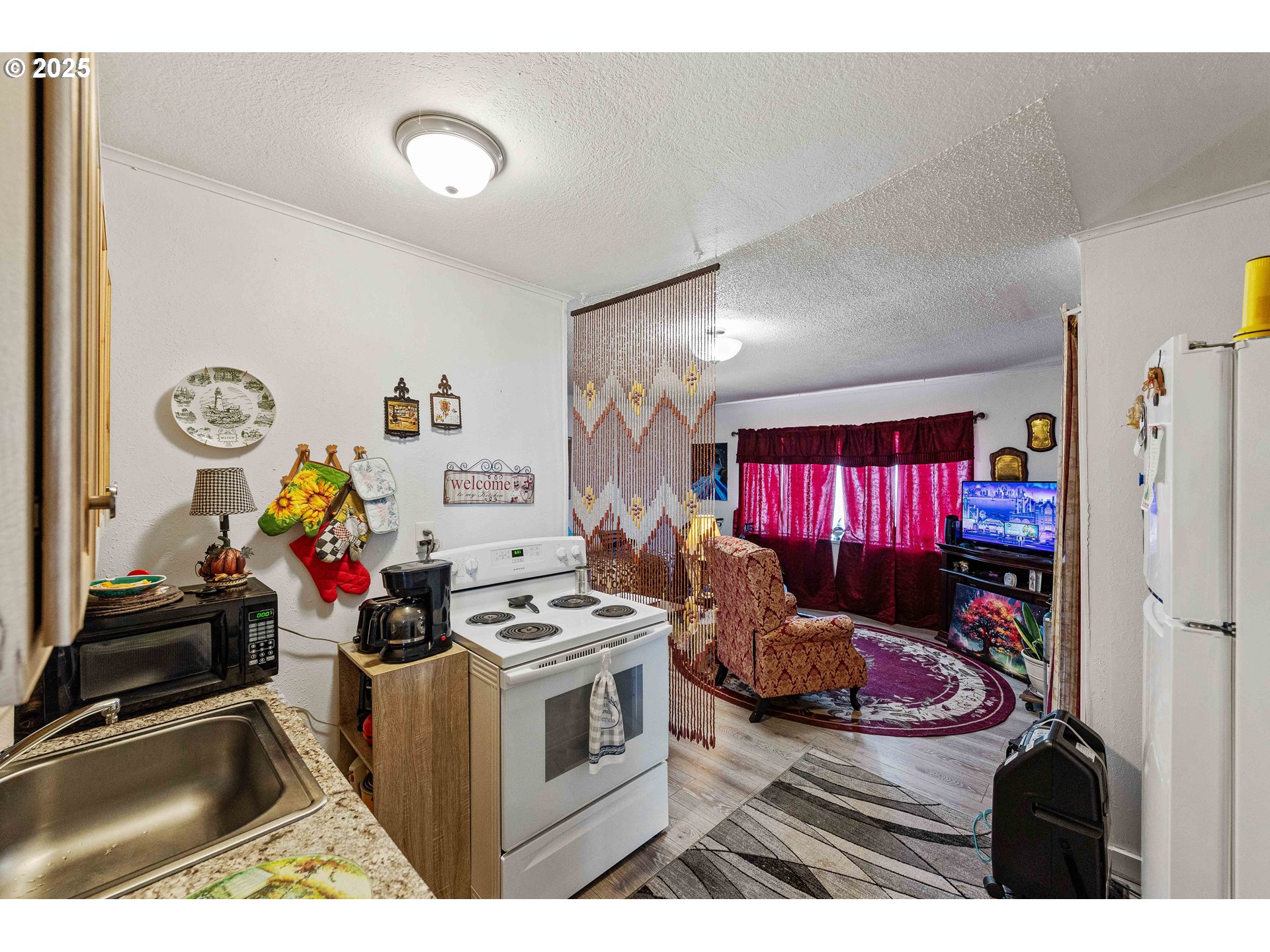 1902 Monroe Street North Bend, OR 97459 - Photo 37 of 48 a view of a kitchen with fridge and window