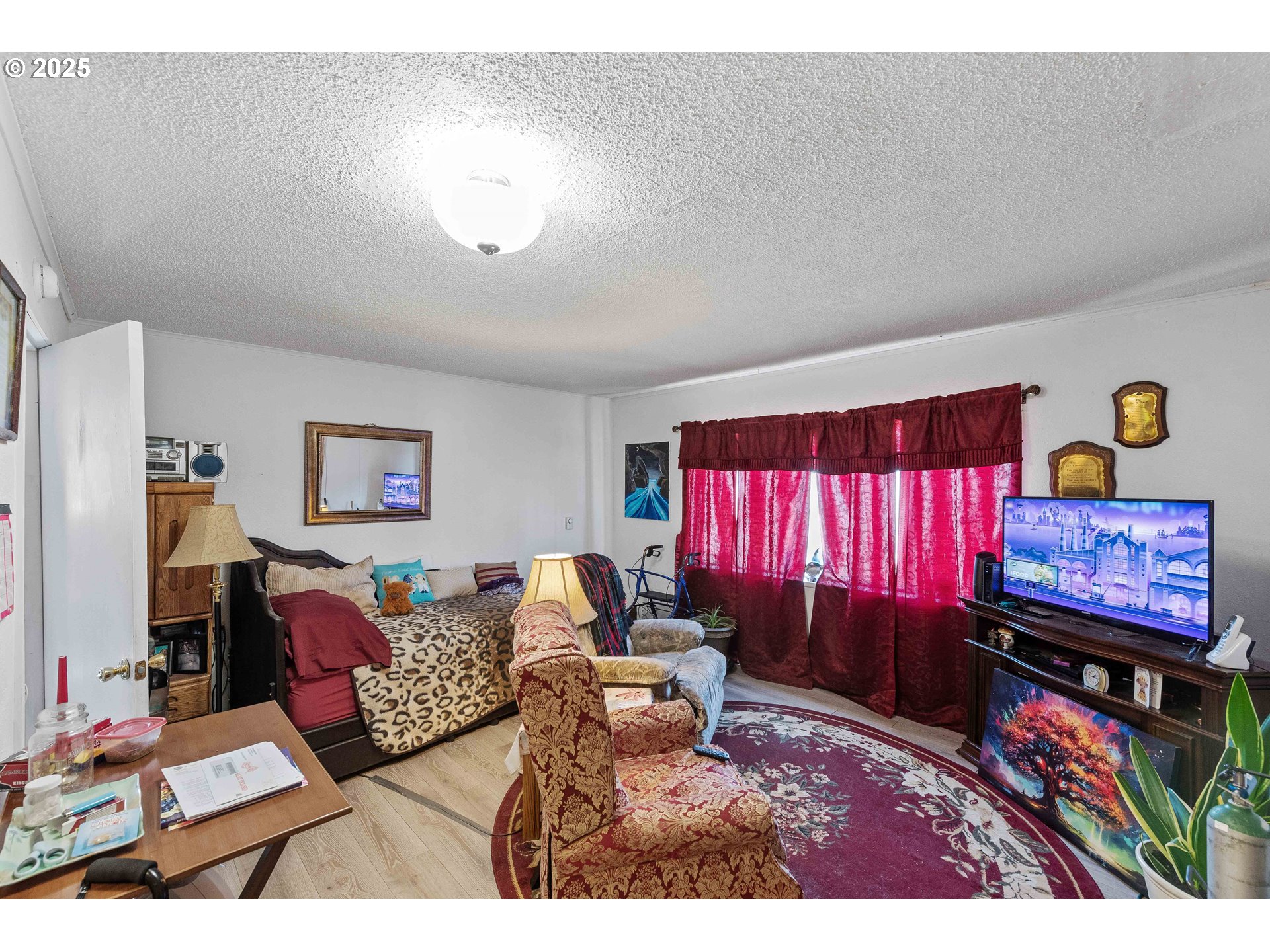1902 Monroe Street North Bend, OR 97459 - Photo 38 of 48 a living room with furniture and a flat screen tv