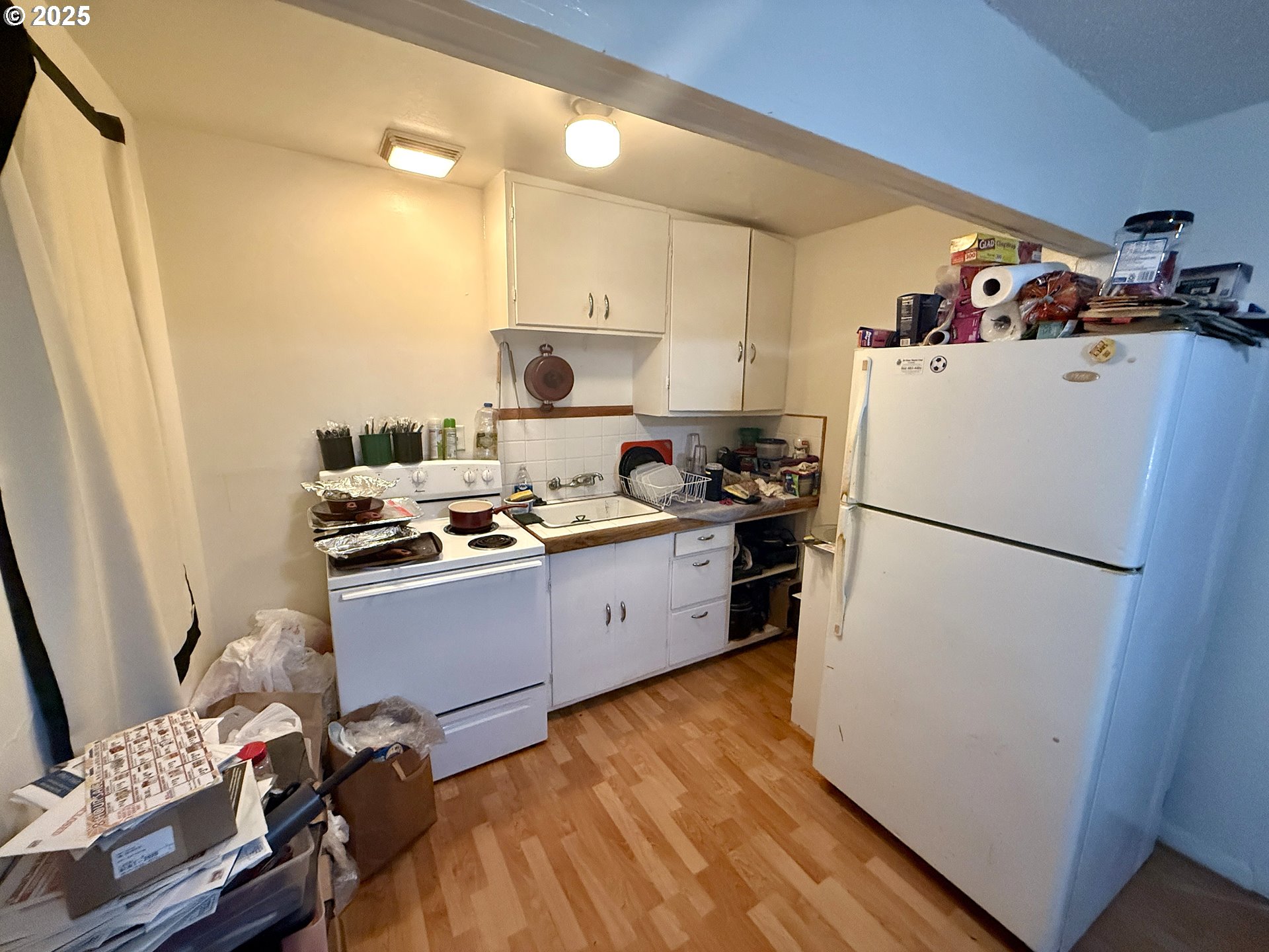1902 Monroe Street North Bend, OR 97459 - Photo 44 of 48 a kitchen with a refrigerator and a stove