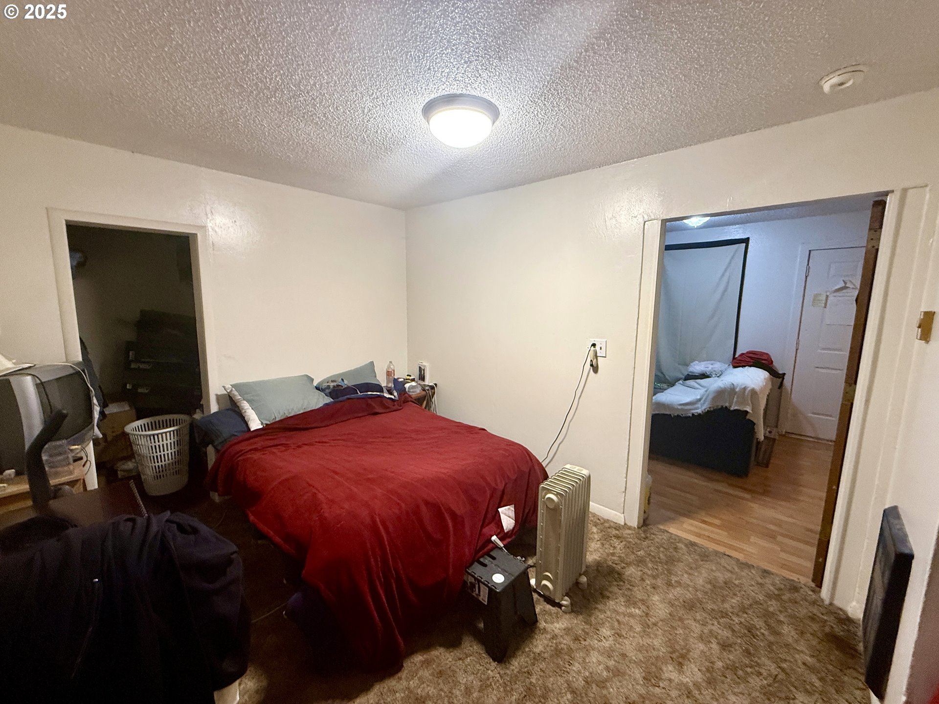 1902 Monroe Street North Bend, OR 97459 - Photo 45 of 48 a bedroom with a bed and a mirror