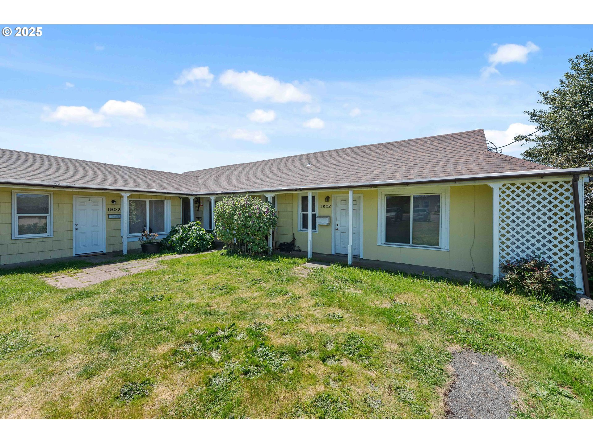 1902 Monroe Street North Bend, OR 97459 - Photo 6 of 48 a view of a backyard with a garden and plants