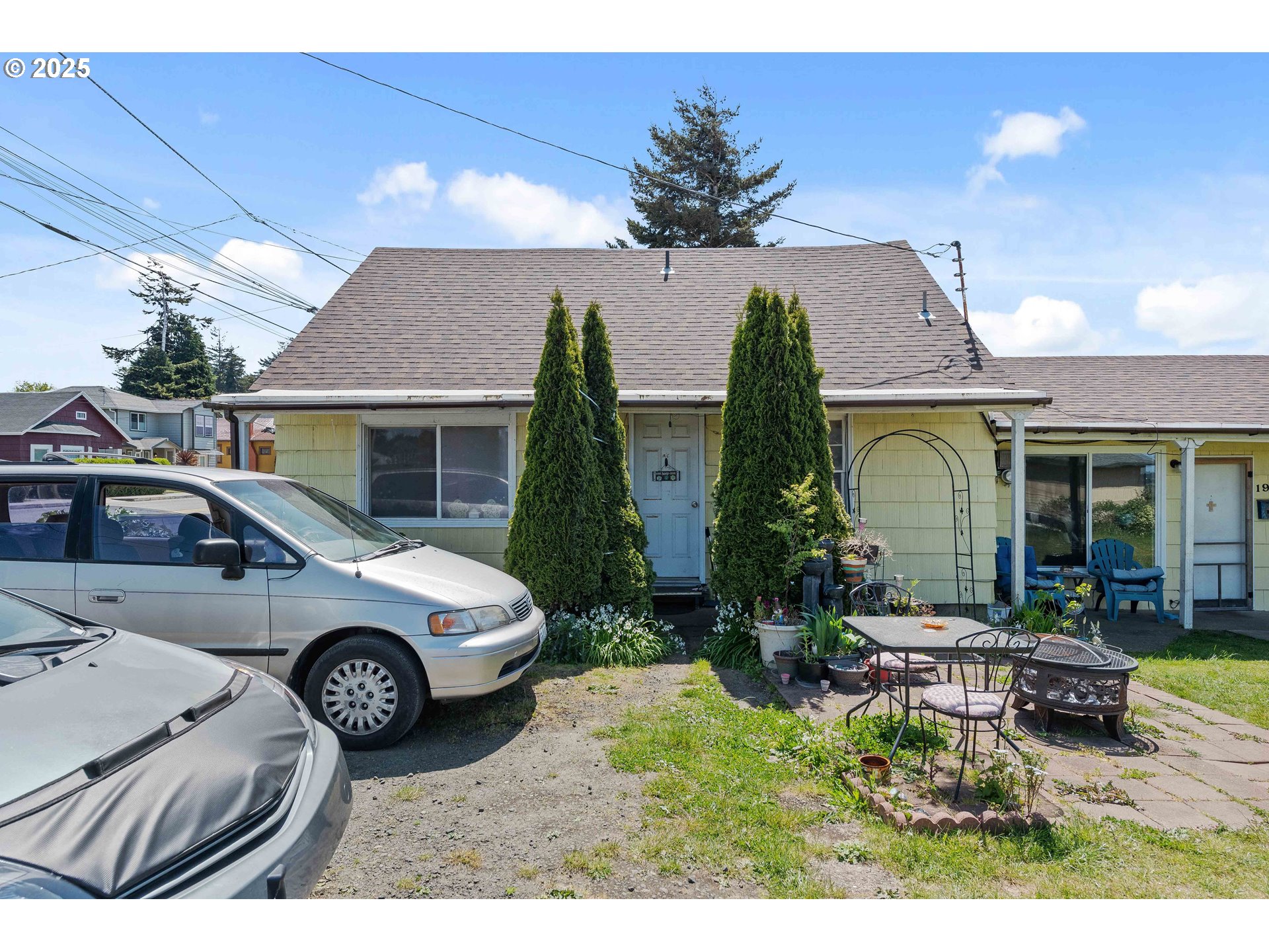 1902 Monroe Street North Bend, OR 97459 - Photo 8 of 48 a couple of cars parked in front of a house