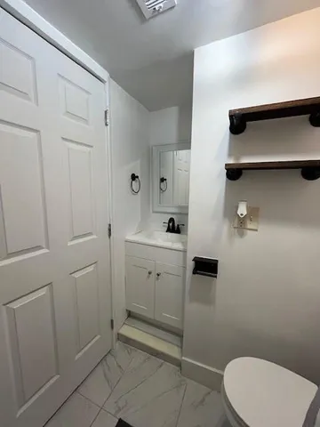 a bathroom with a toilet