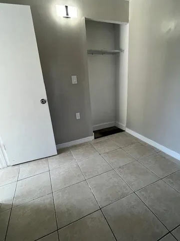 a view of an empty room with windows