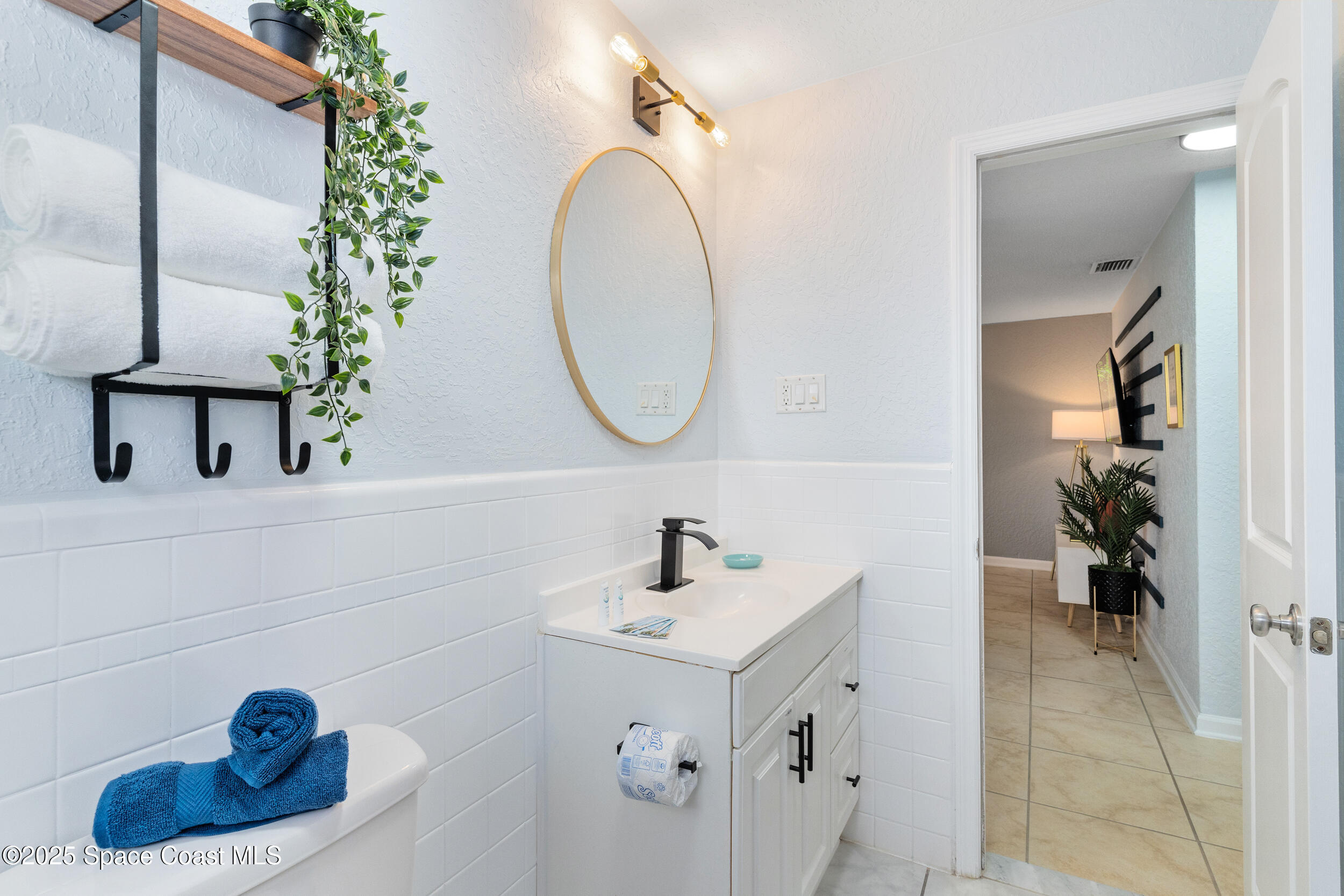 1029 Park Drive, Unit 32 Indian Harbour Beach, FL 32937 - Photo 18 of 35 a bathroom with a sink and a mirror
