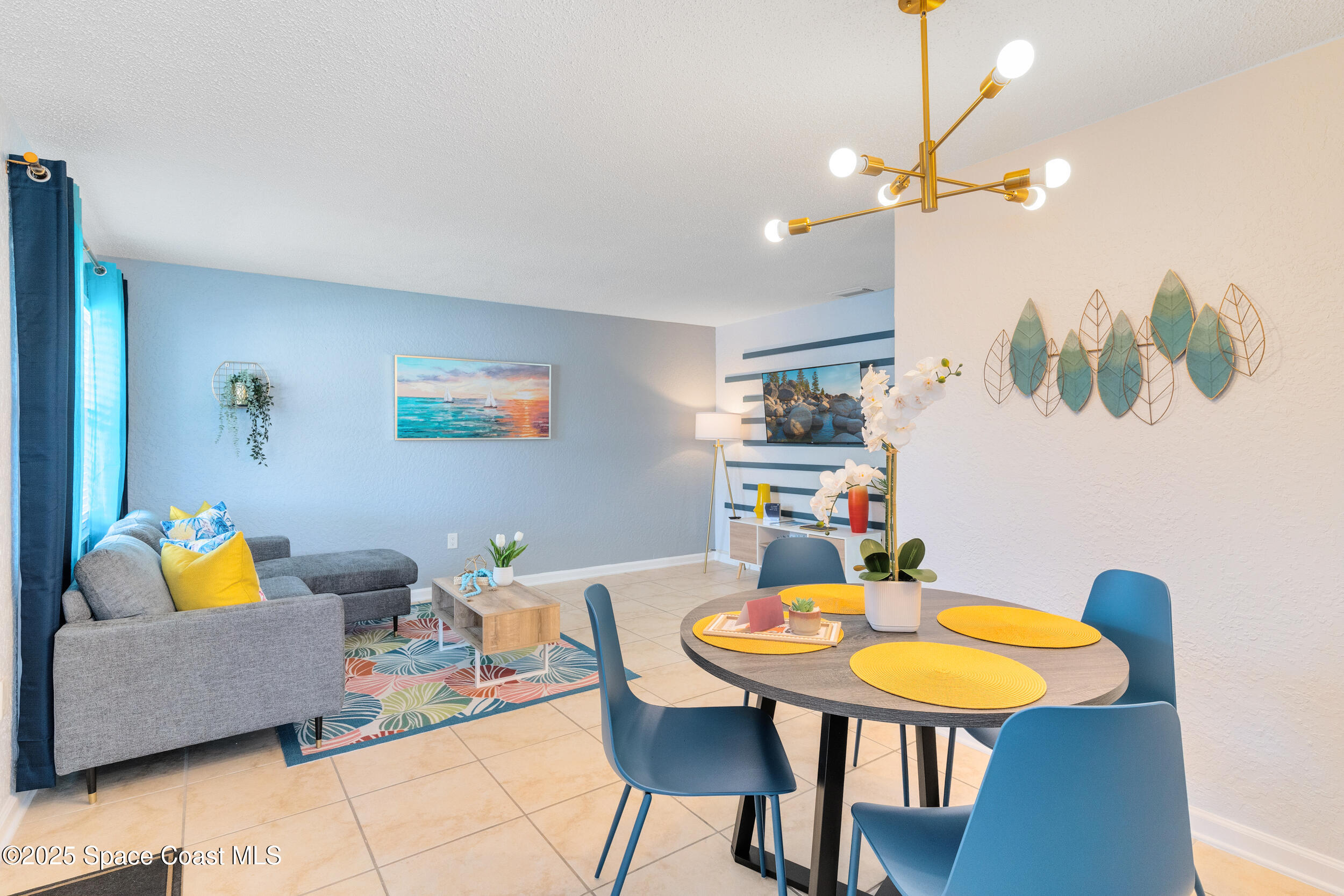 1029 Park Drive, Unit 32 Indian Harbour Beach, FL 32937 - Photo 2 of 35 a living room with furniture and a lamp