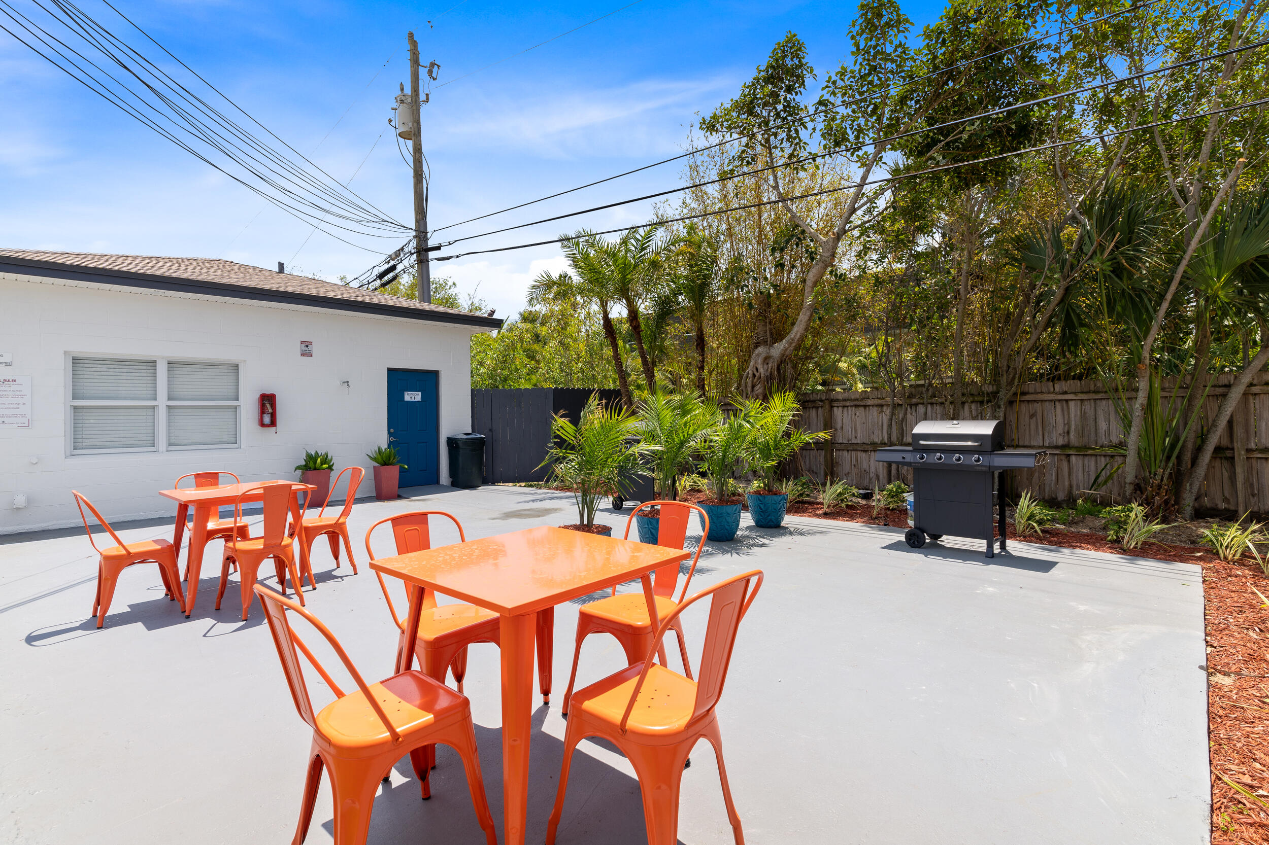 1029 Park Drive, Unit 32 Indian Harbour Beach, FL 32937 - Photo 26 of 35 a view of a patio with table and chairs and potted plants