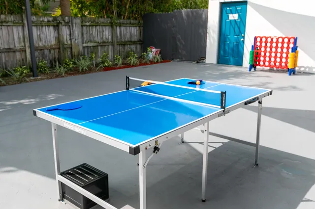 a view of yard from deck with patio