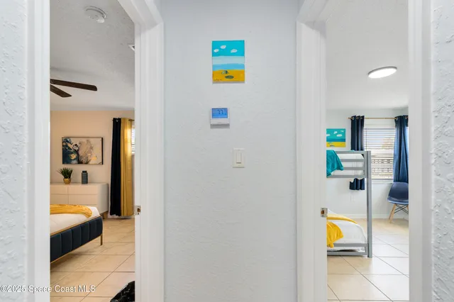 a view of a bedroom with a bed and toys