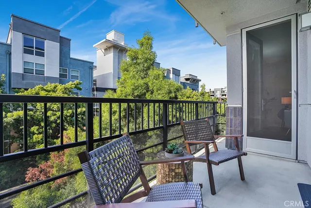 a view of a balcony with furniture