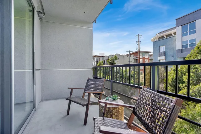 a view of a balcony with furniture