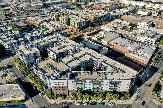 an aerial view of a building with parking