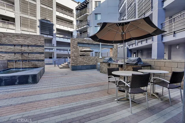 a view of a dinning table and chairs in the patio
