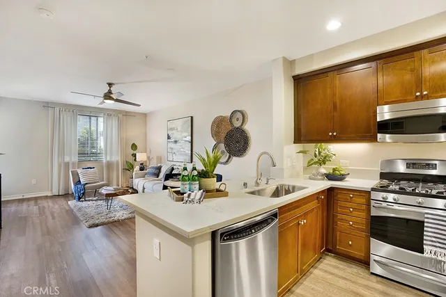 a kitchen with a sink cabinets and wooden floor