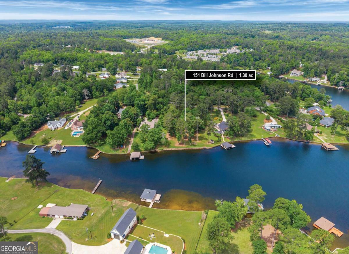 151 Bill Johnson Road Northeast Milledgeville, GA 31061 - Photo 6 of 27 a view of a lake with a house